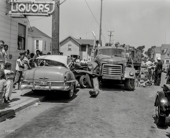 Photo showing: Fruit Cocktail -- Oakland, Calif., circa 1958. Collision between a Plymouth sedan and truck hauling Del Monte canned fruit.