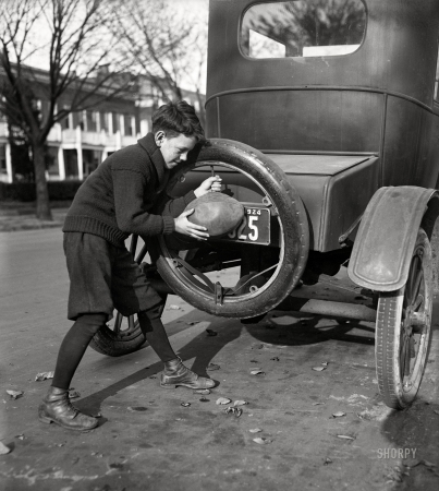 Photo showing: Filling Station. -- Washington, D.C., 1924. Flat spare tires are numerous around Washington these days ... 