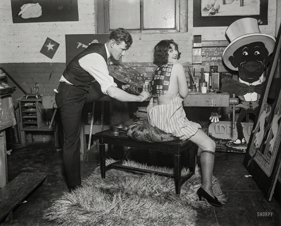 Photo showing: Back Story -- January 1925. Washington, D.C. Man painting woman's back.