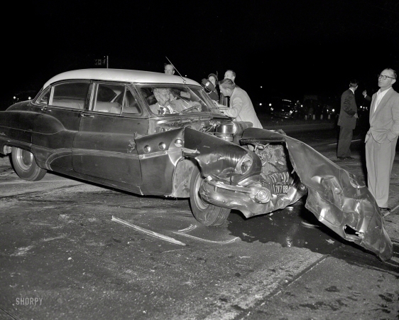 Photo showing: That Was Close -- Oakland circa 1955, and yet another Buick come a cropper.