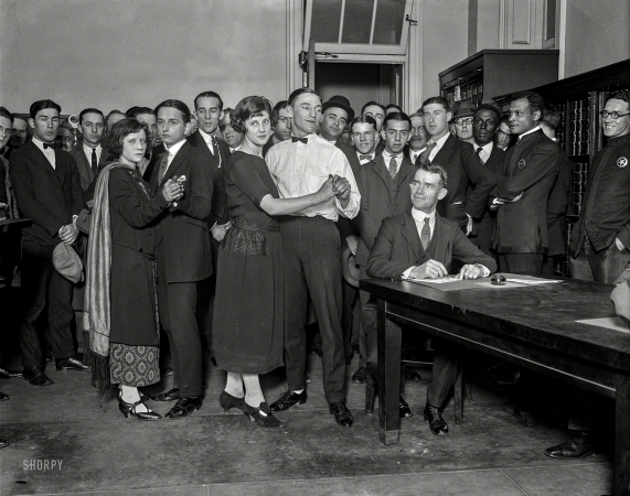 Photo showing: Wed on Their Feet -- May 10, 1923. Evelyn King, Fred W. Newman, Thelma Reese and W. Gately, marathon dancers, getting licenses to marry.