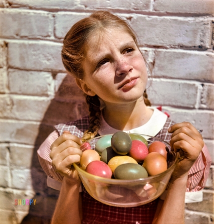 Photo showing: Bacon and Eggs -- New Orleans, 1947. Sidney Bacon with Easter eggs.