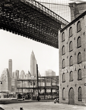 Photo showing: INSPECTION. -- May 22, 1936. Water and Dock Streets, Brooklyn, looking west under Brooklyn Bridge to Lower Manhattan.