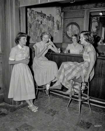 Photo showing: Belle Up to the Bar -- Georgia circa 1956, and some Junior League types at a country-clubby looking bar.