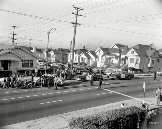 Photo showing: School Zone -- Oakland, California, circa 1957. Wrecked taxi at school crossing.