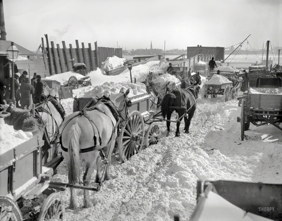 Photo showing: New York Blizzard -- New York, 1899. Dumping snow carts at the river after a blizzard.