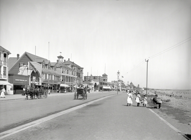 Photo showing: It Is the Fad -- Circa 1905. Along the boulevard -- Revere Beach, Mass.  Note the sign at the tintype photo parlor.