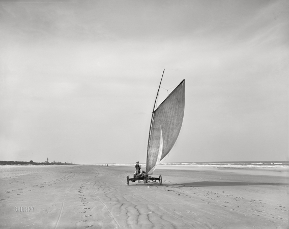 Photo showing: Ride Like the Wind - -- Circa 1903. Sailing on the beach at Ormond, Florida.