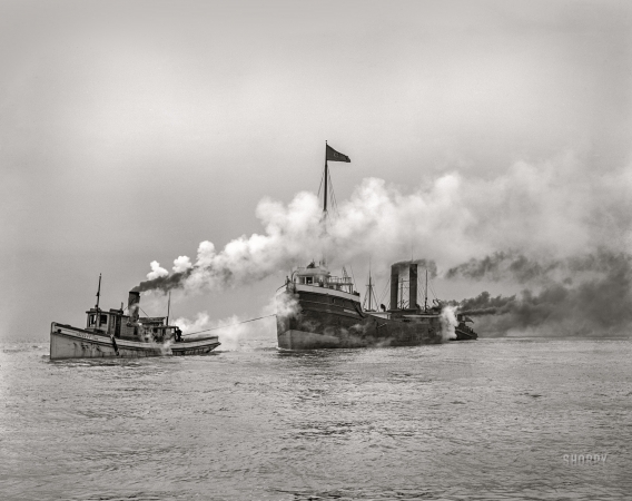 Photo showing: Hauling Mass. -- A tow entering the St. Clair Ship Canal, circa 1905.
The tug Home Rule towing the bulk freighter Massachusetts.