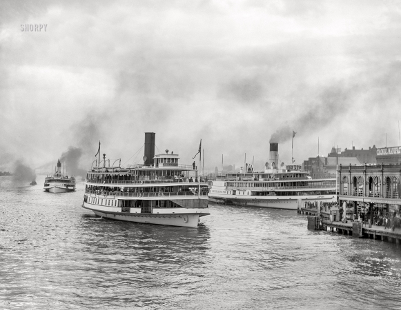 Photo showing: Double-Docked -- The Detroit River circa 1906. Excursion steamers at Belle Isle ferry dock, Woodward Avenue.