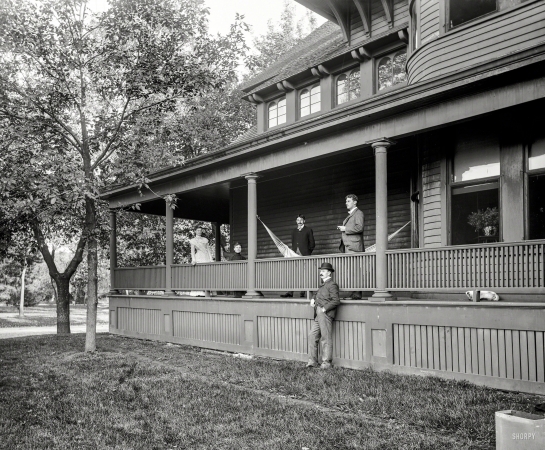 Photo showing: Peeps and Pup -- Circa 1900. C.S. Jackson group on Dudley Walker's porch.