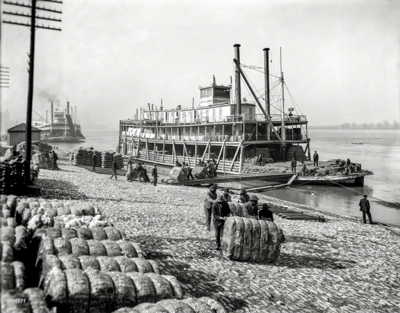 Photo showing: Old Man River --  Unloading cotton at Memphis. The sternwheeler City St. Joseph on the Mississippi River circa 1910.