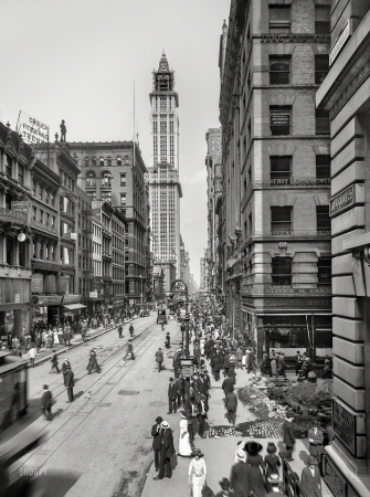 Photo showing: Now Highering -- New York circa 1912. Broadway and Woolworth Building, looking north from Cortlandt Street and Maiden Lane.