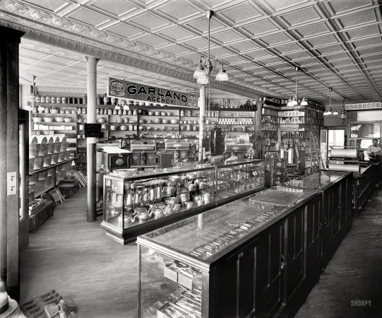 Photo showing: Stoves and Ranges -- Detroit circa 1910. Pickard Gas Co. -- Store interior with gaslight fixtures and Garland Agency display of stoves.
