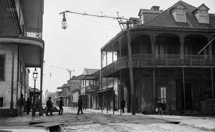 Photo showing: Newer Orleans -- 1890s. The French Quarter, New Orleans. Its carbon arc lamps lighting the way to an electrified future.