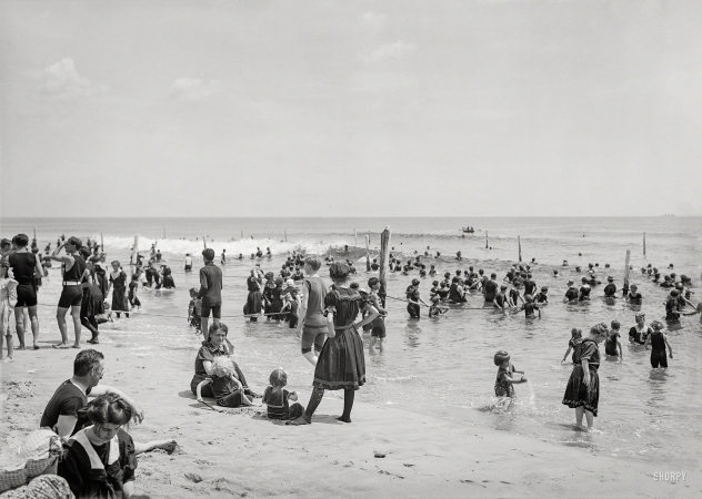 Photo showing: The Good Old Summertime -- Circa 1910. Surf bathers at beach, possibly Atlantic City.