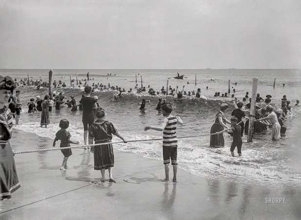 Photo showing: Enter Here: 1910 -- Surf bathers at crowded beach, possibly Atlantic City.