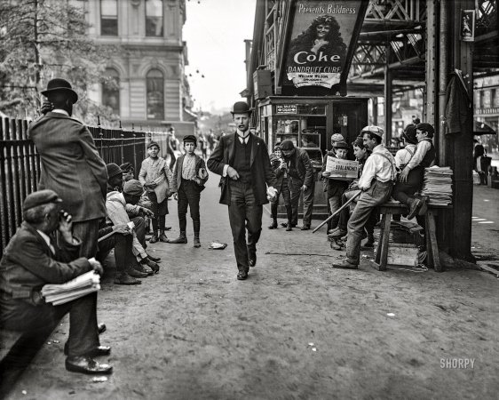 Photo showing: Dandruff ... Avalanche! -- May 1903. New York. Newsboys at Greeley Square.