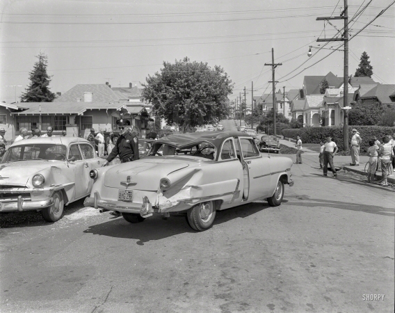 Photo showing: Street Fight -- Plymouth vs. Ford on the streets of Oakland circa 1957.