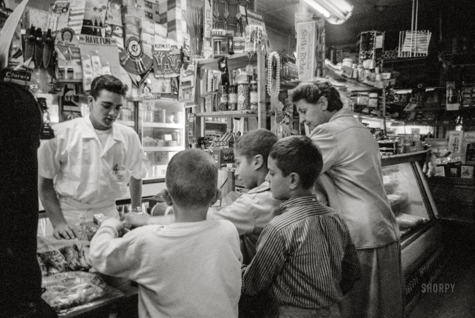Photo showing: Clerk Work -- October 1958. Bill Kolb of White Plains, New York, works part-time as clerk in neighborhood market.