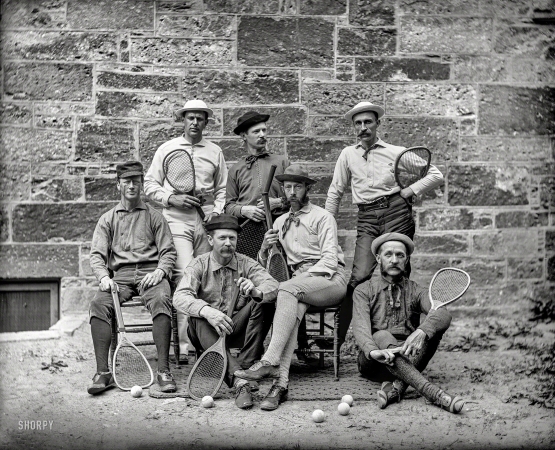 Photo showing: Without a Net -- Boston circa 1895. Seven lawn tennis players posed outdoors holding tennis racquets.