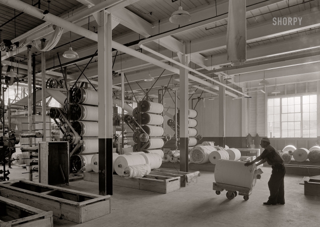 Photo showing: Cloths Makes the Man -- April 22, 1932. Ware Shoals, South Carolina. Cotton cloth printing machine from rear.