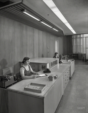 Photo showing: None Shall Pass. -- January 25, 1955. Becton Dickinson Inc., Rutherford, New Jersey. Double secretarial desk.