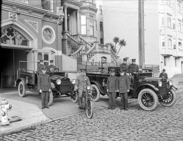 Photo showing: The Firehouse -- San Francisco, 1921. Sonora Fire Dept. (Tuolumne County) REO trucks at Engine Company No. 15 firehouse, California Street.