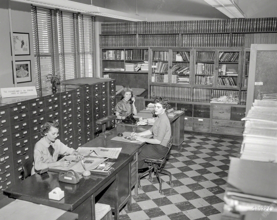Photo showing: Cultivated Minds -- Columbus, Georgia, circa 1952. Library staff. On the premises of the Columbus Enquirer.