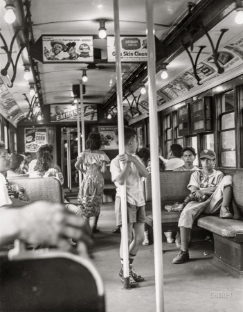 Photo showing: Game Over -- -- June 25, 1949. When day is done in Brooklyn (boys in subway car filled with passengers).