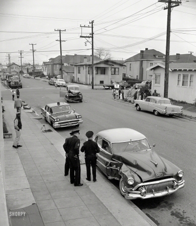 Photo showing: The Case of the Battered Buick -- Oakland, Calif., circa 1958, and yet another fender-bender.