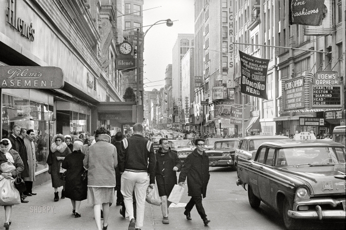 Photo showing: Filenes Basement -- February 9, 1963. Boston, Mass. Pedestrians on Washington Street walking by Filene's department store.