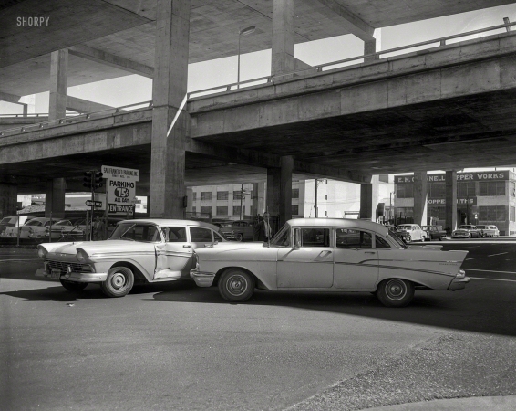 Photo showing: Ford vs Chevy -- '57 Ford meets '57 Chevy under a San Francisco freeway circa 1958.