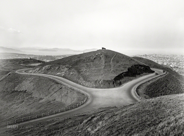 Photo showing: Lonely at the Top -- San Francisco circa 1925. Auto at Twin Peaks -- North Peak seen from South Peak.