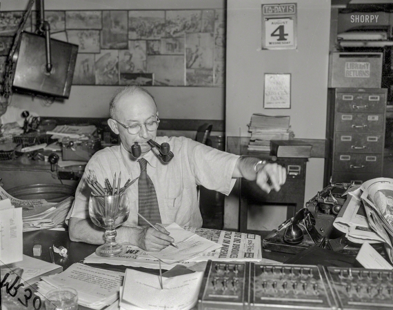 Photo showing: Pencils-n-Pipes -- August 4, 1954. An editor in the tobacco-friendly newsroom of the Chicago Sun-Times.