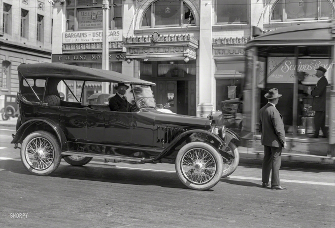 Photo showing: Caught in Passing. -- San Francisco circa 1920. Chalmers touring car on Van Ness Avenue.