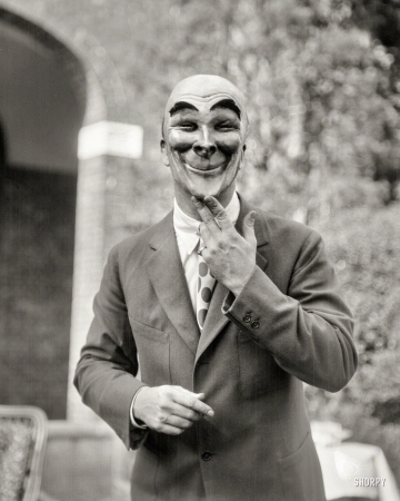 Photo showing: Anonymous -- Sept. 20, 1925. Man wearing a mask made by W.T. Benda.