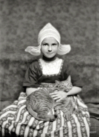 Photo showing: Silvester, the Cat -- March 3, 1913. Miss Marjorie Silvester and Buzzer the cat.
