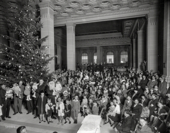 Photo showing: A Crocker Christmas -- December 1925. Christmas tree and Santa Claus at Crocker National Bank, Post & Montgomery Streets, San Francisco.