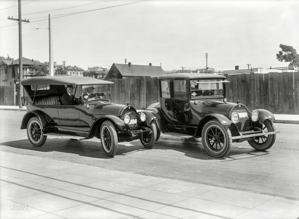 Photo showing: A Couple of Cads -- San Francisco circa 1919. Cadillac touring car and sedan.