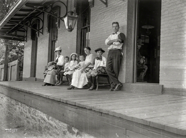 Photo showing: The Poughkeepsie Peeper -- New York circa 1900. Waiting for the train, Depot near Poughkeepsie.