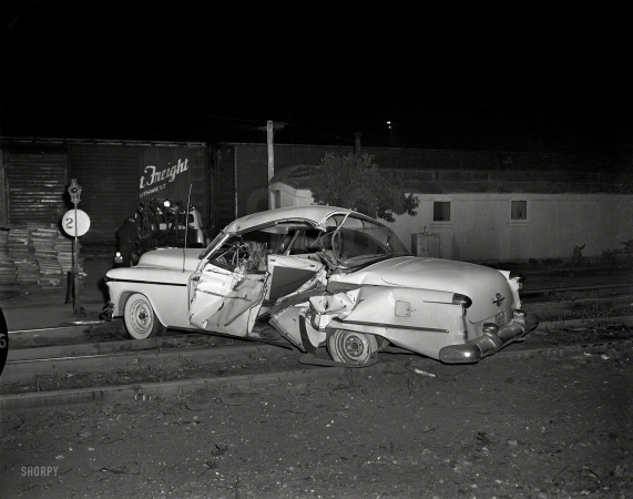 Photo showing: Lucky Lager -- Oakland 1957. Accident on tracks. Note the beer can next to the rail.