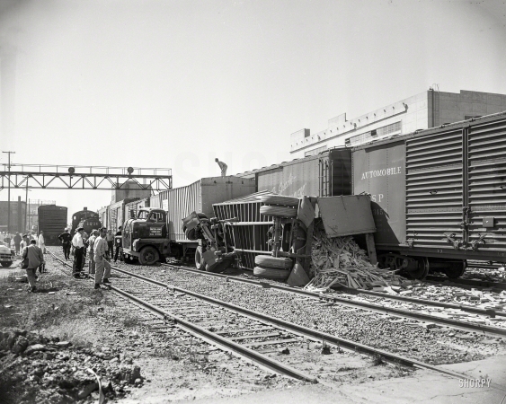 Photo showing: Trailer Trashed -- Railyard accident. Oakland again, circa 1954, and the Curious Case of the Tipped Trailer.