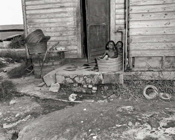 Photo showing: Two in a Tub -- Columbus, Georgia, circa 1950, and another still from the housing series.