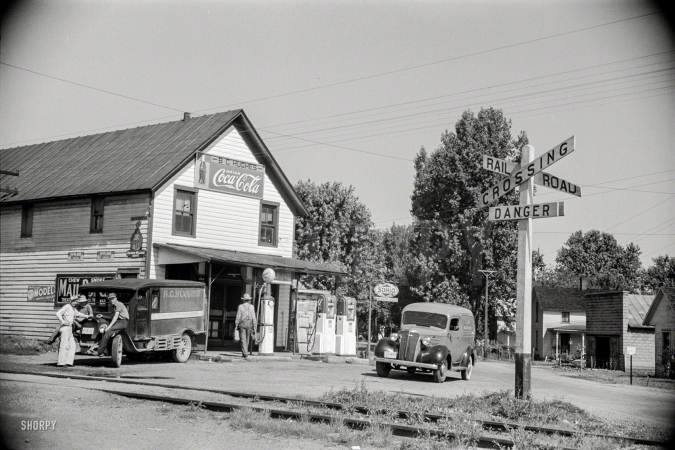 Photo showing: Alt-Atlanta -- May 1938. General store and railroad crossing, Atlanta, Ohio.