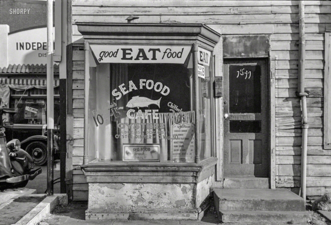 Photo showing: Good EAT Food -- January 1938. Washington, D.C. Cafe on L Street.