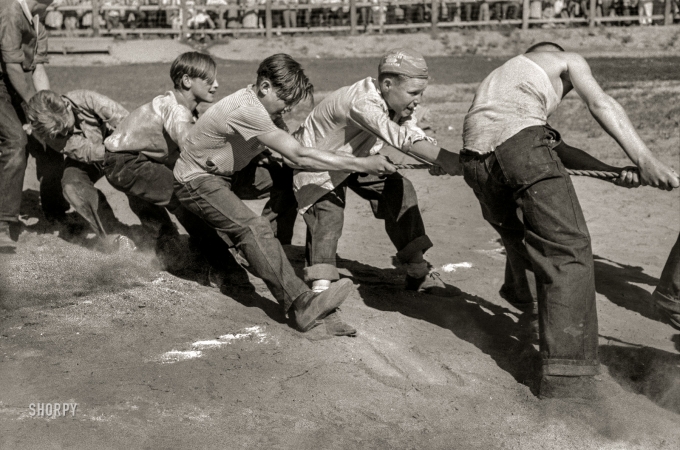 Photo showing: Pulling Together -- July 1941. Boys' tug of war, Fourth of July celebration. Vale, Oregon.