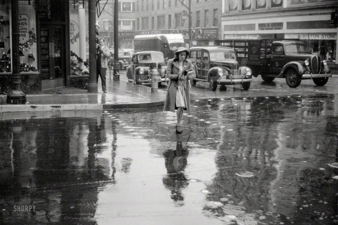 Photo showing: Rainy Day Woman -- November 1940. Main street intersection in Norwich, Connecticut, on a rainy day.