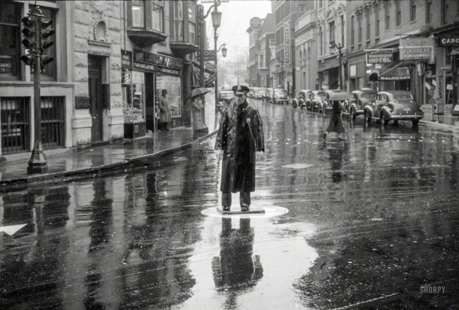 Photo showing: Proceed With Caution. -- November 1940. Street scene on a rainy day in Norwich, Connecticut.