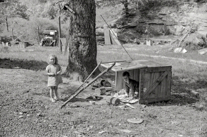 Photo showing: Tot Box -- September 1938. WPA worker's children with toys in their play yard. South Charleston, West Virginia.